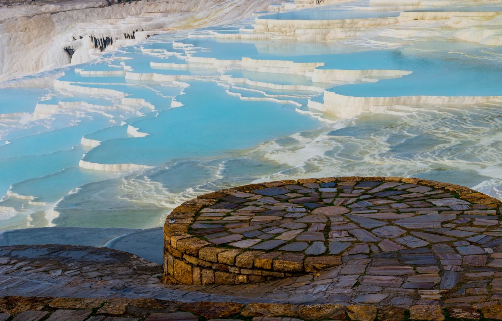 Pamukkale travertine terraces with turquoise water