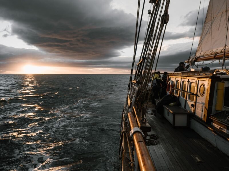 Bodrum Blue Cruise — wooden sailing ship at sunset, illustrative