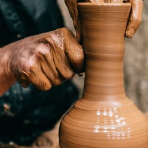 Avanos museum area — hands shaping clay on a potter's wheel