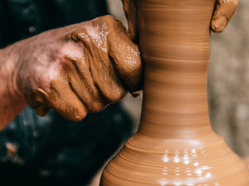 Avanos museum area — hands shaping clay on a potter's wheel